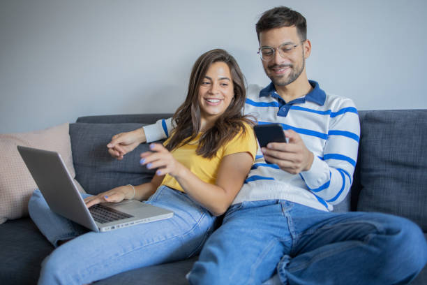 istock Couple planning vacation trip and searching information on internet 1482071418