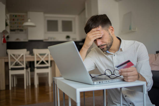 istock Man using her credit card to shop online 1482071551