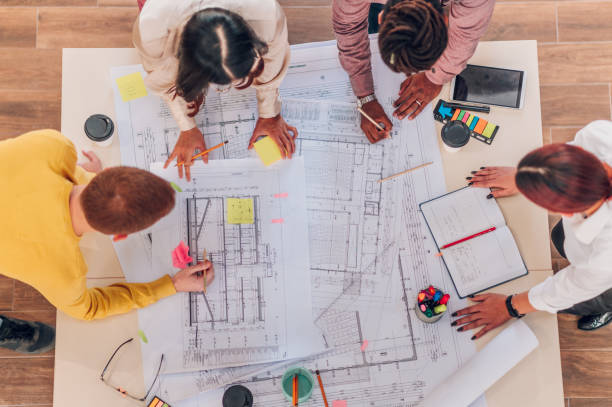 istock Diverse group of engineers or architects having a meeting in an office 1482071884
