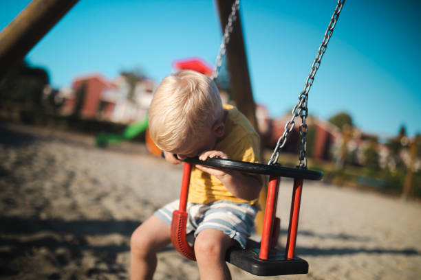 istock A cute boy spends the day on the children's playground 1482072677