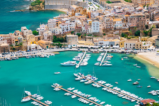 Panorama of Western Sicily - view of the Mediterranean Sea and Castellammare del Golfo Bay with numerous white yachts.