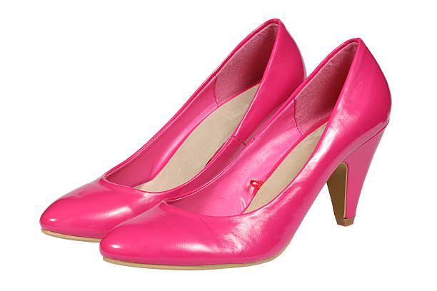 A pair of pink women's heel shoes isolated over white with clipping path.