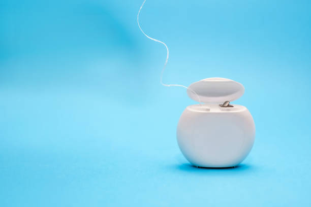 istock Dental floss for cleaning teeth on a blue background 1482083490