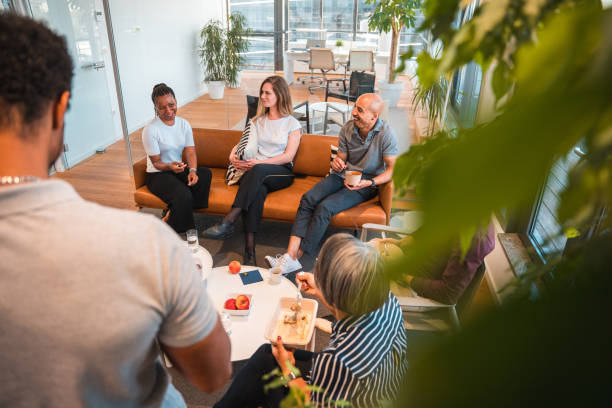 istock High Angle of Entrepreneurs Talking while Eating Indoors 1482085110