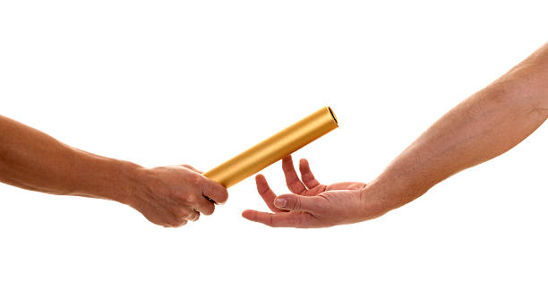 istock People passing a baton to each other over white background 148208856