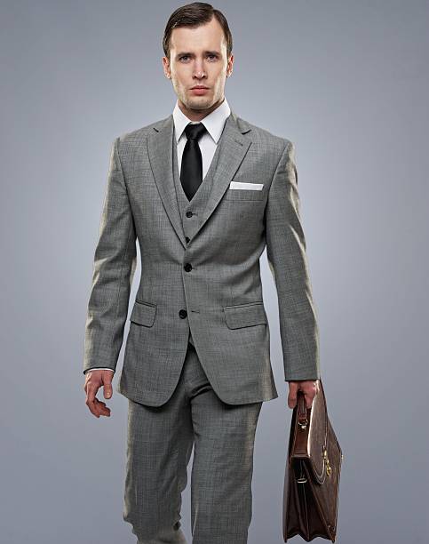 istock Businessman with a briefcase isolated on grey. 148209438