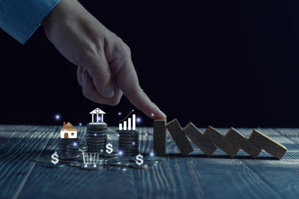 istock Economic collapse concept, hands stop domino crisis effect, financial and banking problems, recession, financial crisis, bad debt, inflation and interest rates,  asset safety 1482095672