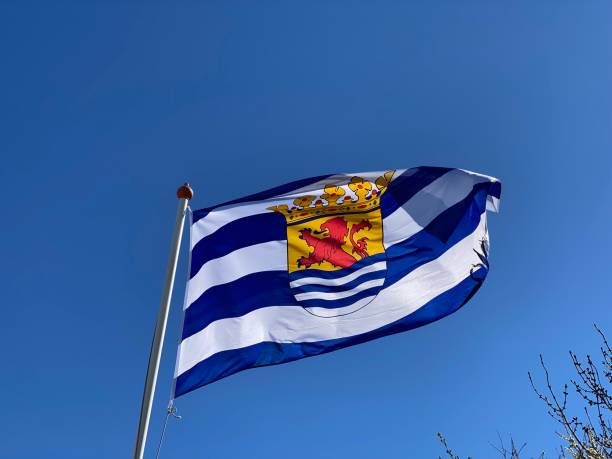 istock Flag of Zeeland against a blue sky 1482112404