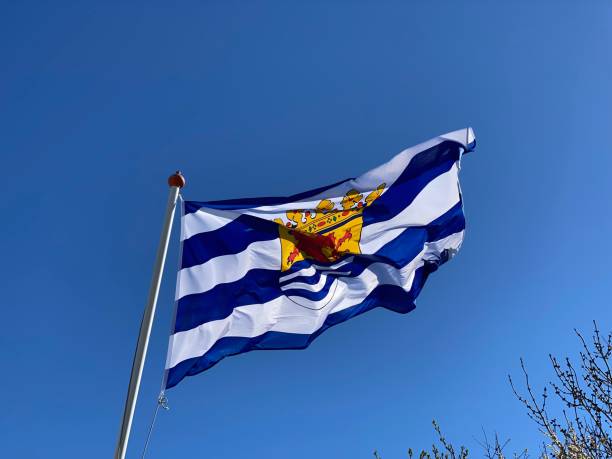 istock Flag of Zeeland against a blue sky 1482112541