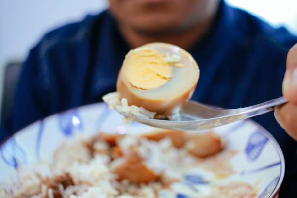 man having Thai  Breakfast