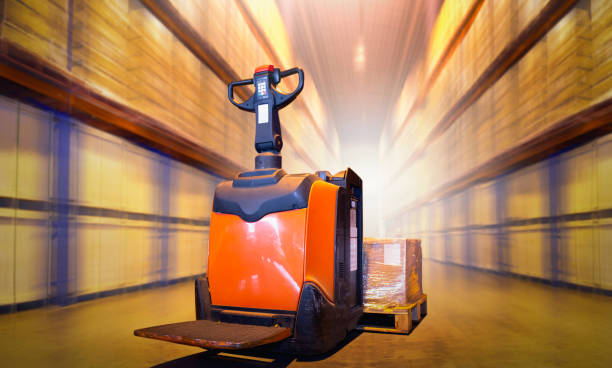 istock Electric Forklift Pallet Jack with Package Boxes on Pallet. Forklift Loader. Storage Warehouse. Supply Chain. Shelf Storehouse Shipping Supplies Distribution. Warehouse Logistics. 1482119538