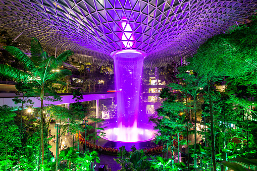 Changi, Singapore - February 2, 2023: Waterfall inside Jewel Changi Airport entertainment and retail complex in Singapore.
