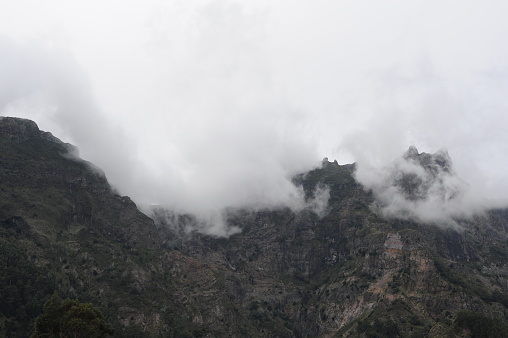 Mountain range and peaks covered in clouds, fog and mist on Madeira Island , Portugal, Europe
