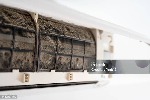 Dirty In Dust And Mold Air Conditioner Filter Closeup Home Air Conditioner Maintenance Stock Photo - Download Image Now