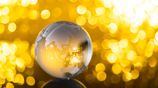 Glass globe on shiny background