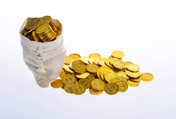 The treasure chest is filled to the brim with shimmering gold coins and colorful gems, radiating a sense of fortune and discovery against a bright backdrop.