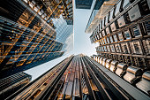 Looking directly up at the skyline of the financial district in central London - creative stock image