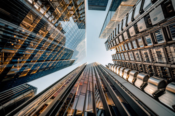 Looking directly up at the skyline of the financial district in central London - creative stock image stock photo