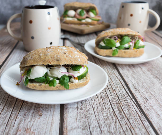 istock Sandwiches with mozzarella and ham. on a wooden background 1482142575