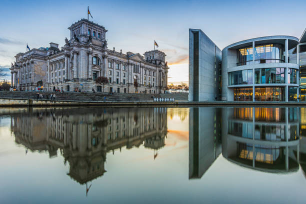 istock Two government buildings in Berlin at sunset with reflection 1482144229