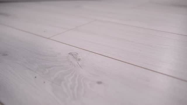 Diagonal pattern of white wood effect laminate in motion