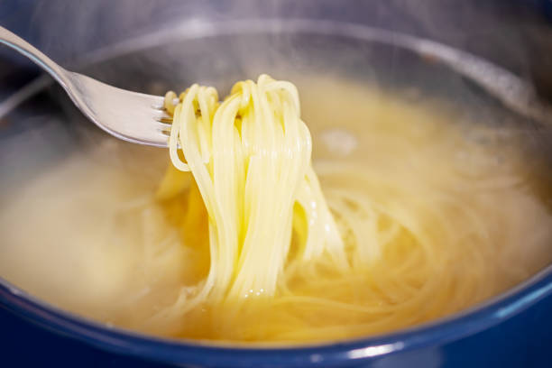 istock Spaghetti is cooked in boiling water in a saucepan 1482144404
