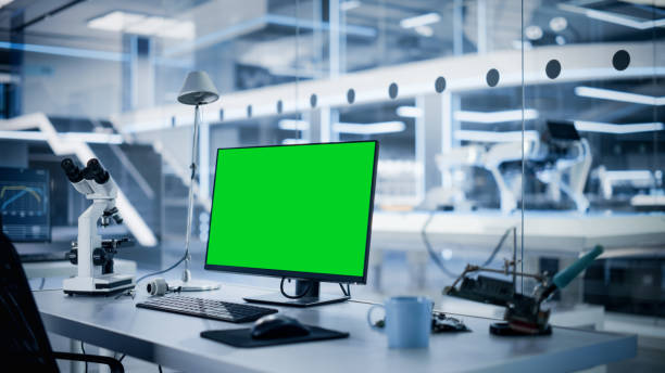 istock Modern Industrial Research Laboratory with Desktop Computer with Green Screen Mock Up Display. Scientific Lab, Engineering Research Center Full of High-Tech Equipment, Technology for Robot Development 1482147620