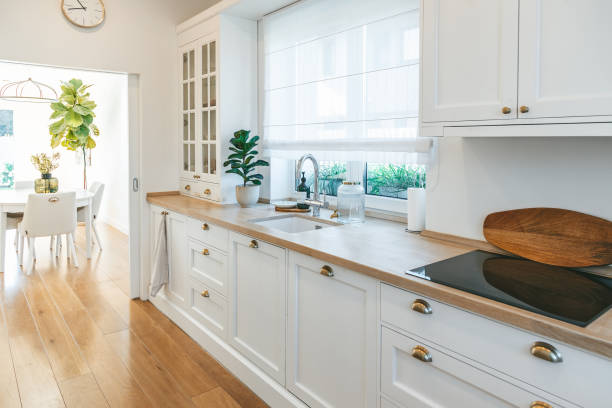 istock Cozy bright spacious white kitchen made in classic style 1482147678