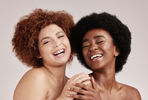 Friends, beauty and face with skincare and women, happy with inclusive cosmetic care on studio background. Natural cosmetics, healthy skin and diversity with melanin, makeup and dermatology with glow