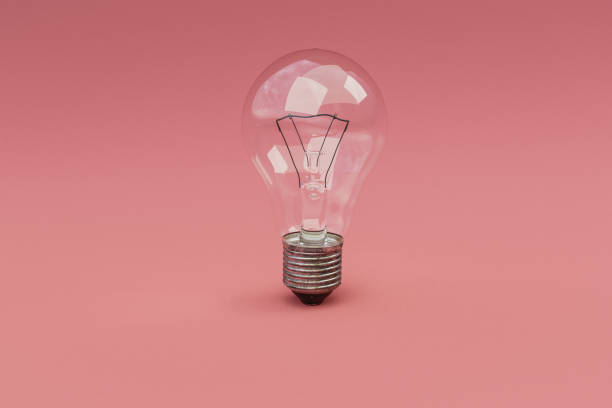 istock retro style lightbulbs with glowing filament standing on infinite colorful background; creativity design concept; 3D Illustration 1482147852