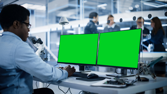 Developer Lab Clean Software Developer Working On Computer With Green Screen Mock Up ...