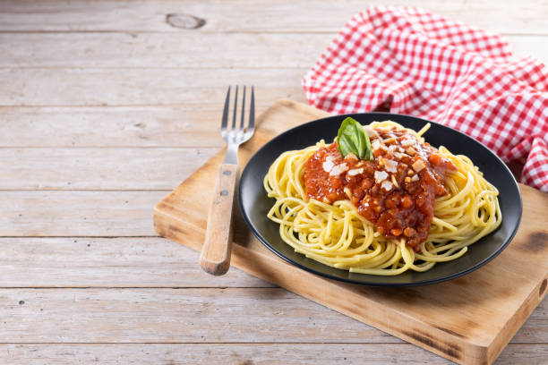 istock Spaghetti with bolognese sauce on wooden table 1482150107