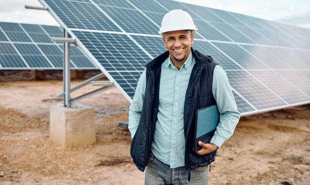 istock Solar environment, man and portrait of engineering industry. Happy technician, manager and renewable energy of building, future innovation and architecture of electricity, sustainability and sun grid 1482160545