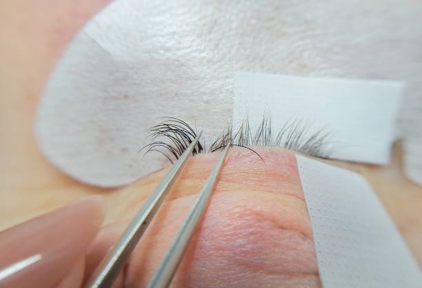 close up of eye with eyelash extensions ,beauty salon treatment close up of eye with eyelash extensions ,beauty salon treatment,2d volume,3d volume,russian volume,mega volume clump eyelashes stock pictures, royalty-free photos & images