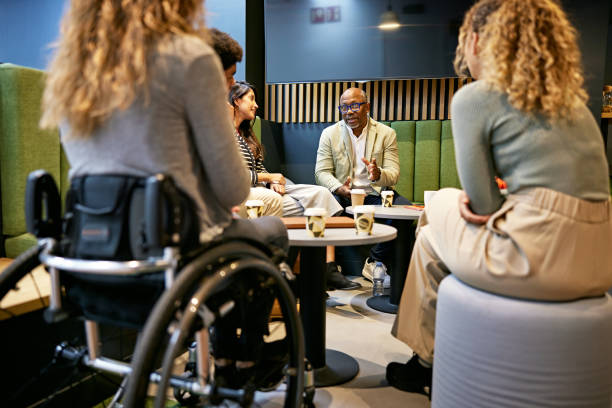 istock Business team together, drinking coffee, and sharing ideas 1482163967