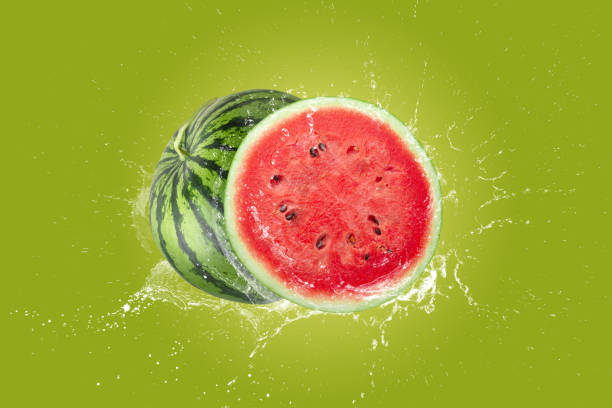 Creative layout made from watermelon and water Splashing on a green background.