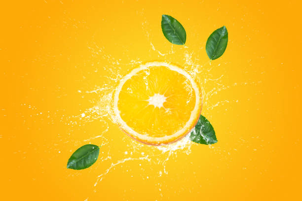 istock Creative layout made from Fresh Sliced oranges and Orange fruit and water Splashing on a orange background. 1482167030