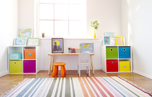 Comfortable room with colourful furniture in sunny day. Concept of the child room and kindergarten.
