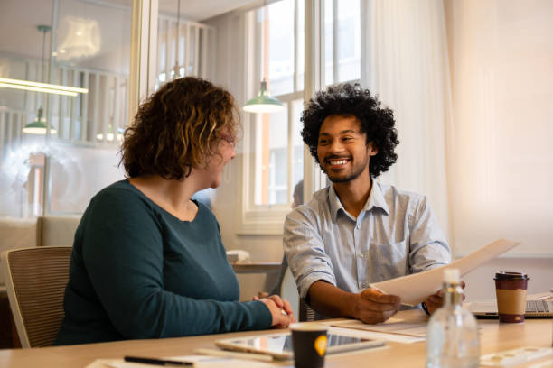 istock man talking to business colleague 1482167530