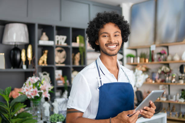 Salesman for a portrait Salesman poses for a portrait at a neighborhood business market vendor stock pictures, royalty-free photos & images