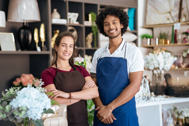 istock Employees pose for portrait in store 1482168429