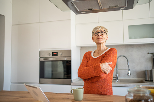 Portrait of a senior woman in her kitchen