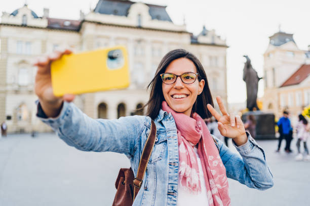 istock A young woman enjoys taking selfies and video calling 1482171513