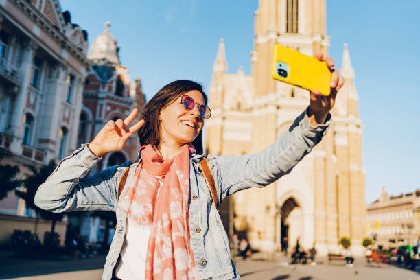 istock A young woman enjoys taking selfies and video calling 1482171580