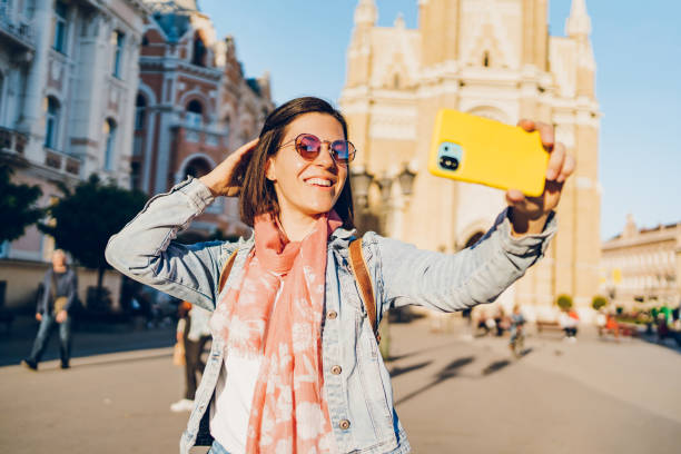 istock A young woman enjoys taking selfies and video calling 1482171727