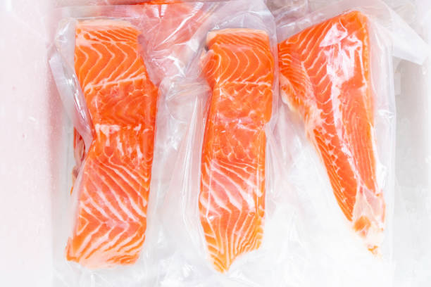 istock Fresh salmon fillet in vacuum package for delicious salmon menu. 1482178574
