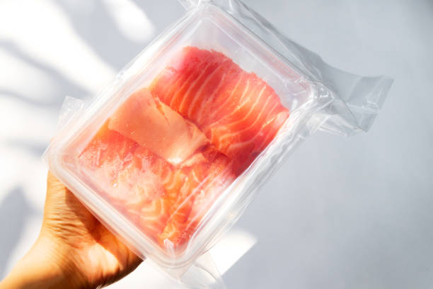 istock Fresh salmon and toro sashimi in vacuum package on hand. 1482178617