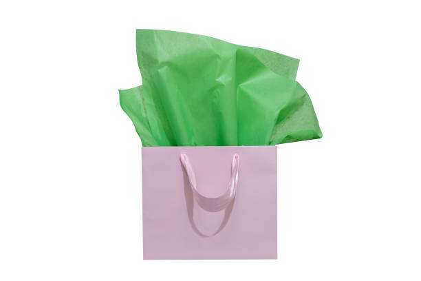 istock Craft paper gift bag with tissue paper isolated on a white background 1482180350