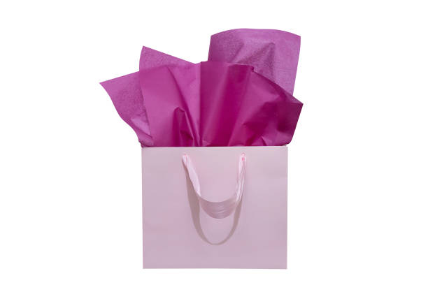 istock Craft paper gift bag with tissue paper isolated on a white background 1482180351