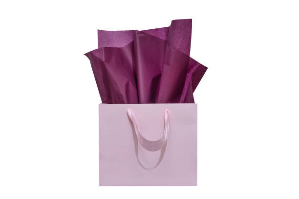 istock Craft paper gift bag with tissue paper isolated on a white background 1482180389